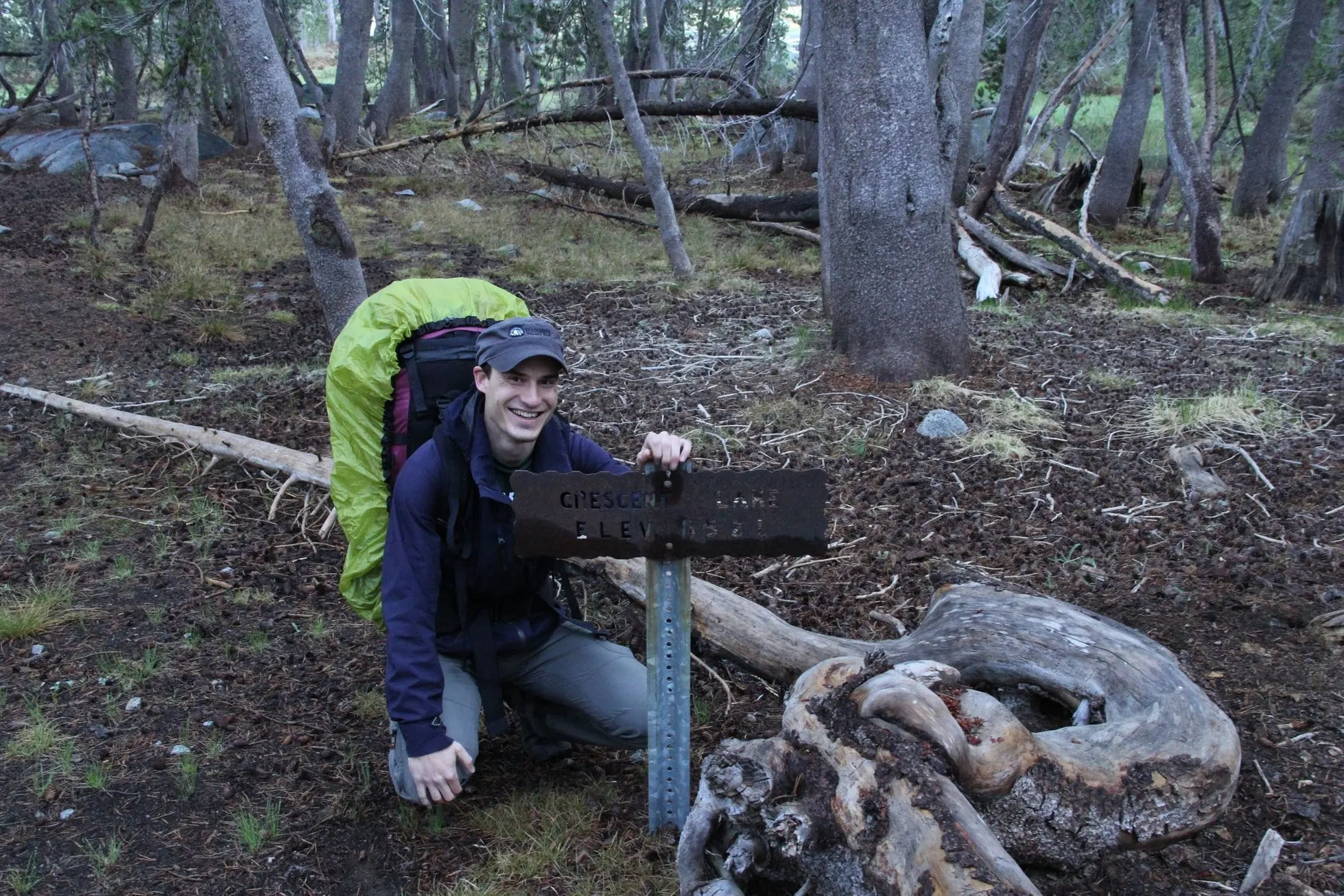 Me next to a yosemite trail sign